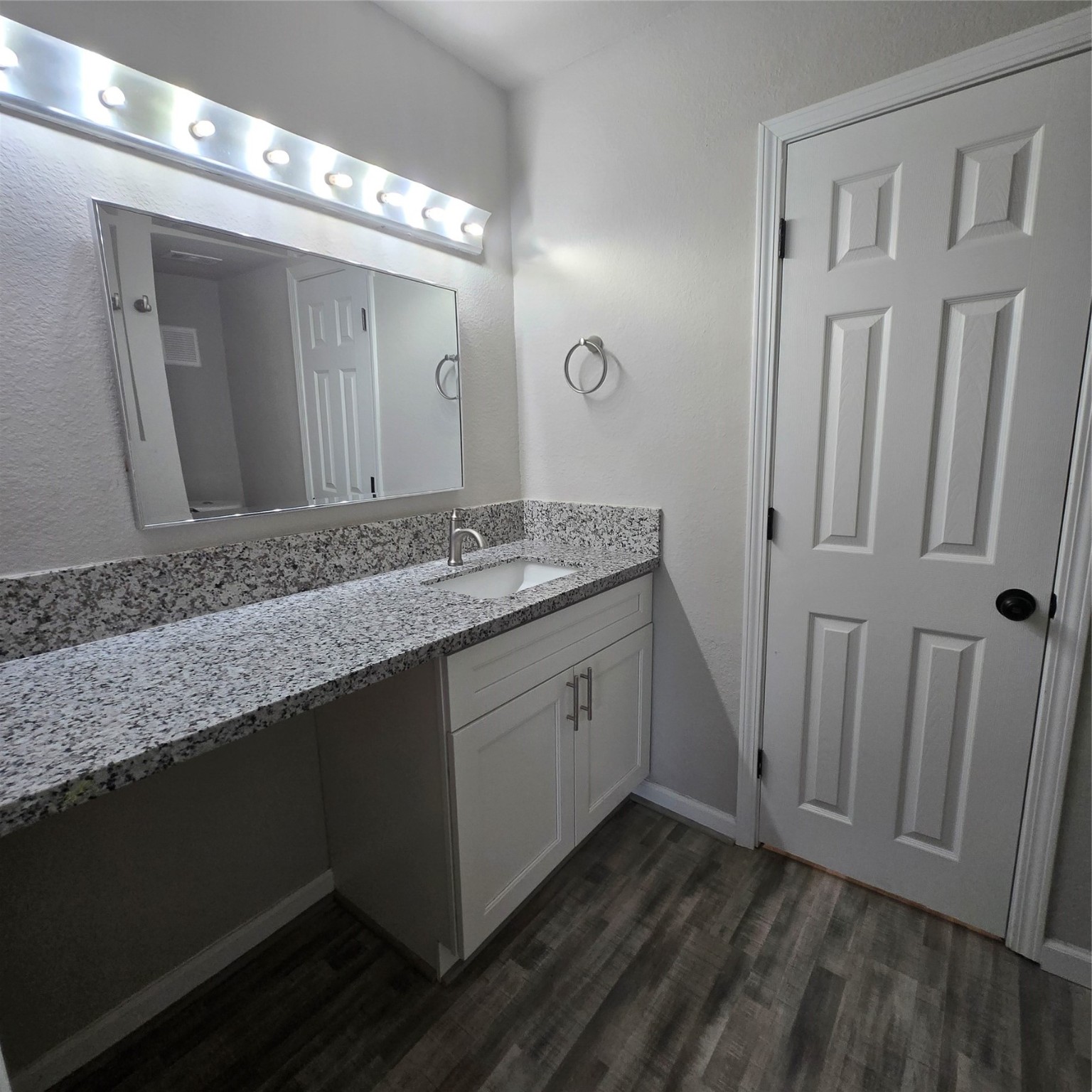 8355 Nairn Street Houston, TX 77074 - Photo 11 of 21 a bathroom with a granite countertop sink and a mirror