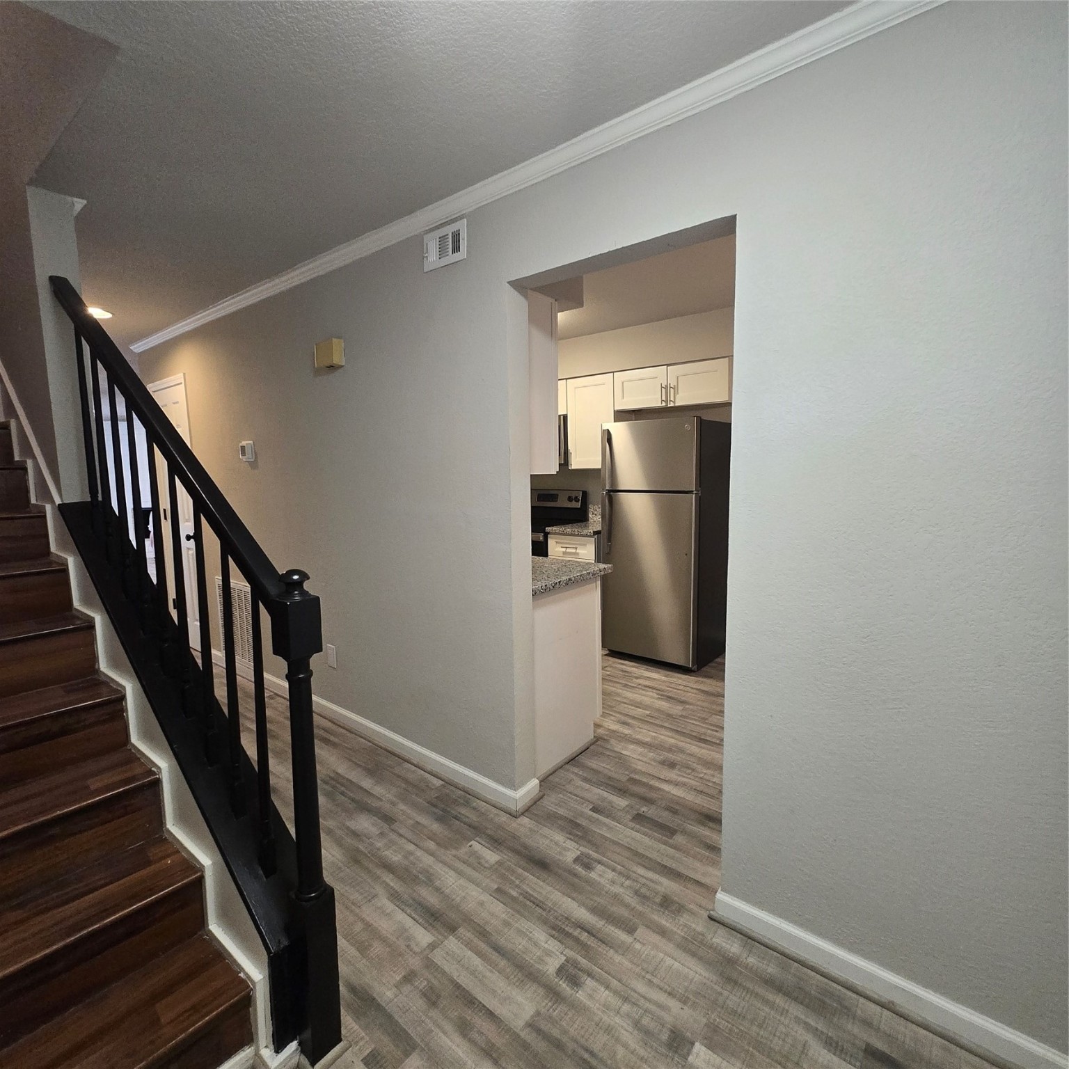 8355 Nairn Street Houston, TX 77074 - Photo 15 of 21 a view of a kitchen with a sink and refrigerator