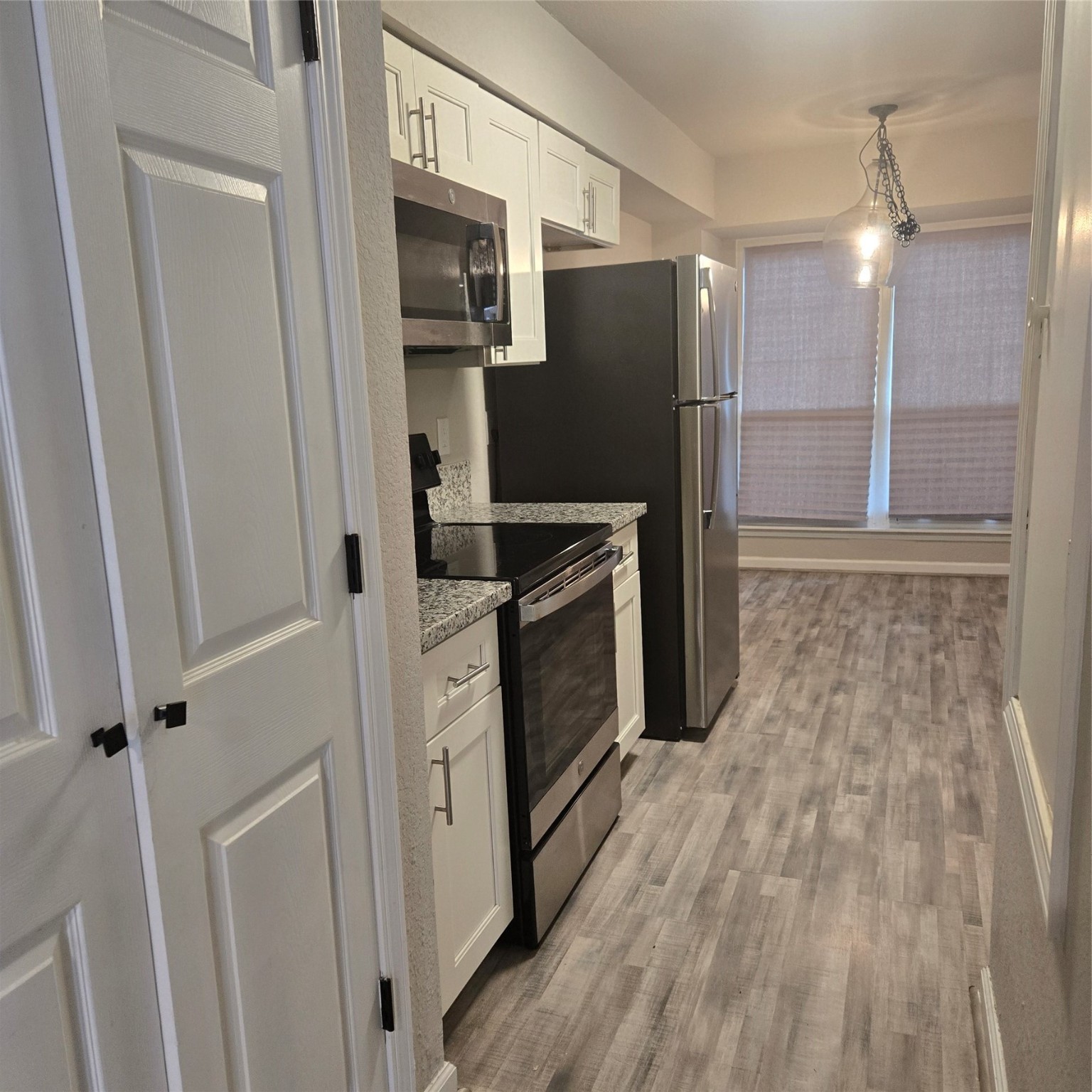 8355 Nairn Street Houston, TX 77074 - Photo 18 of 21 a kitchen with granite countertop a refrigerator and a sink