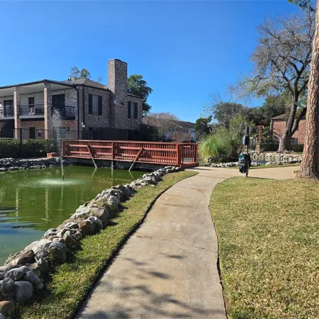 a view of a lake with a yard