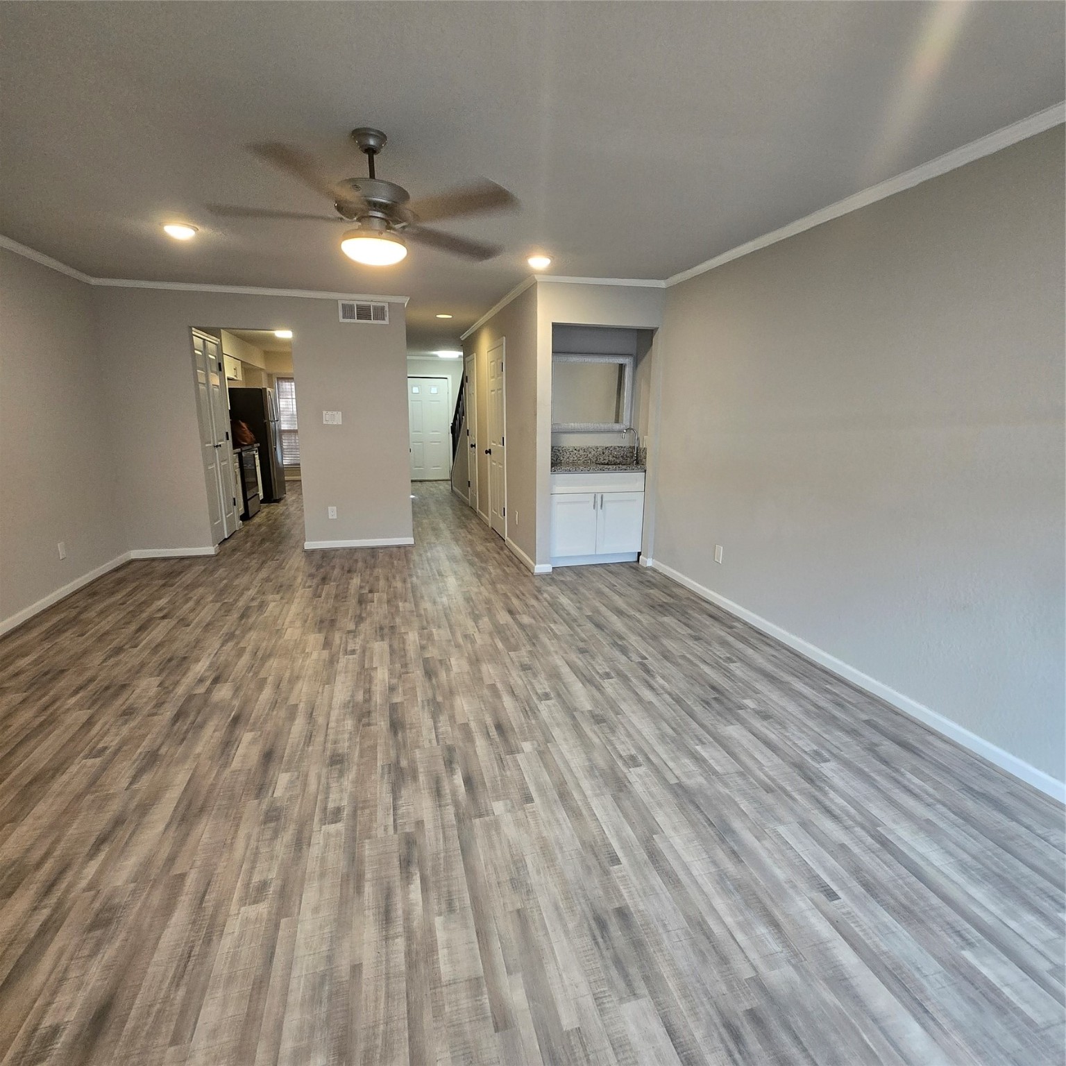 8355 Nairn Street Houston, TX 77074 - Photo 3 of 21 a view of empty room with wooden floor