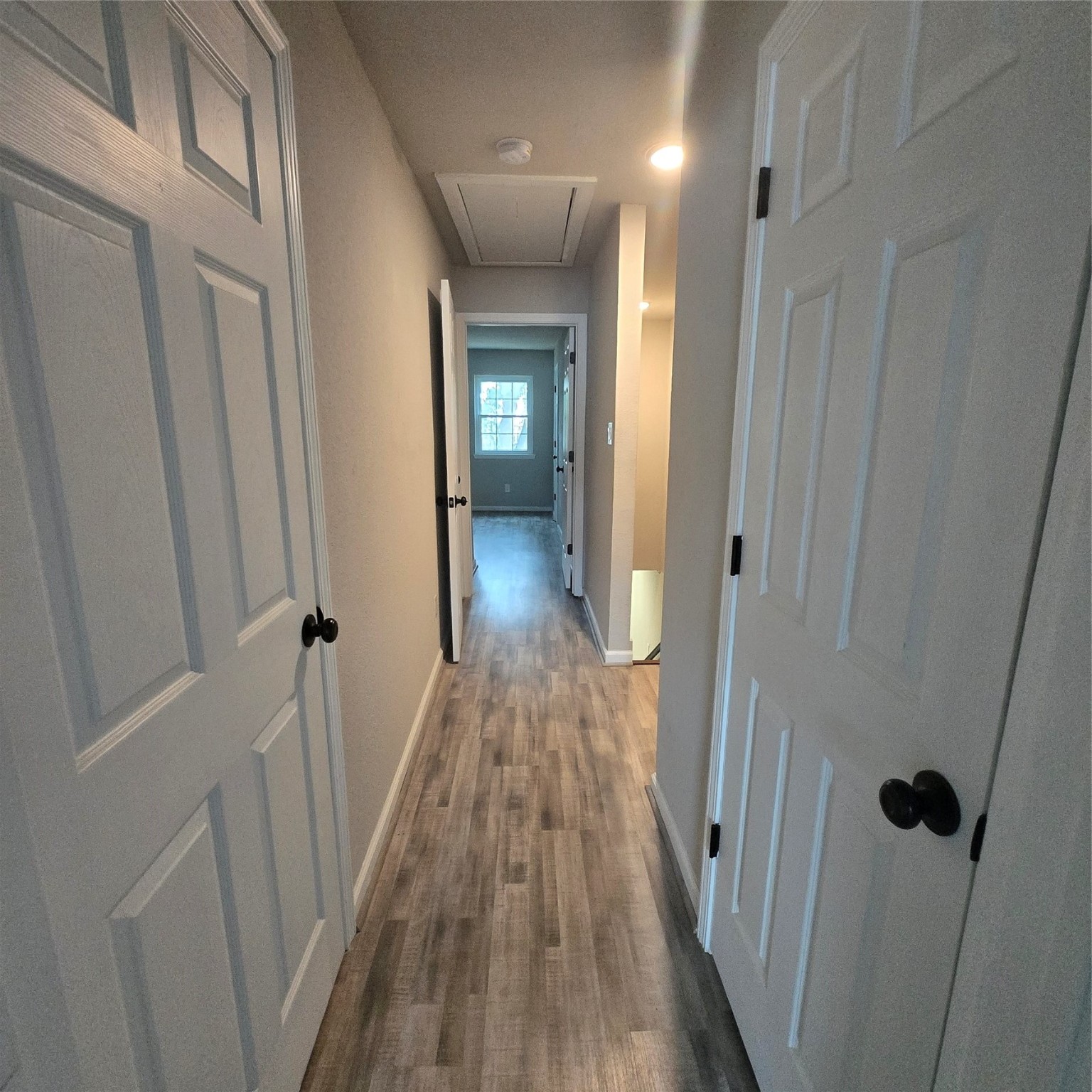 8355 Nairn Street Houston, TX 77074 - Photo 8 of 21 a view of a hallway with wooden floor and closet area