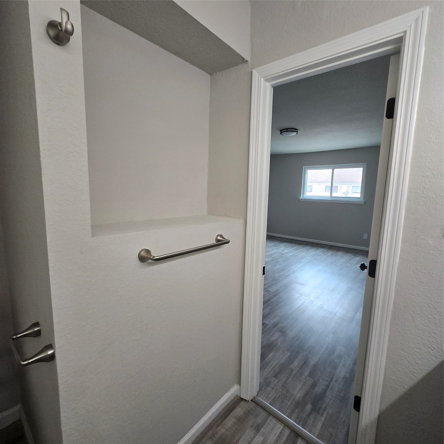 8355 Nairn Street Houston, TX 77074 - Photo 10 of 21 a view of a hallway with wooden floor