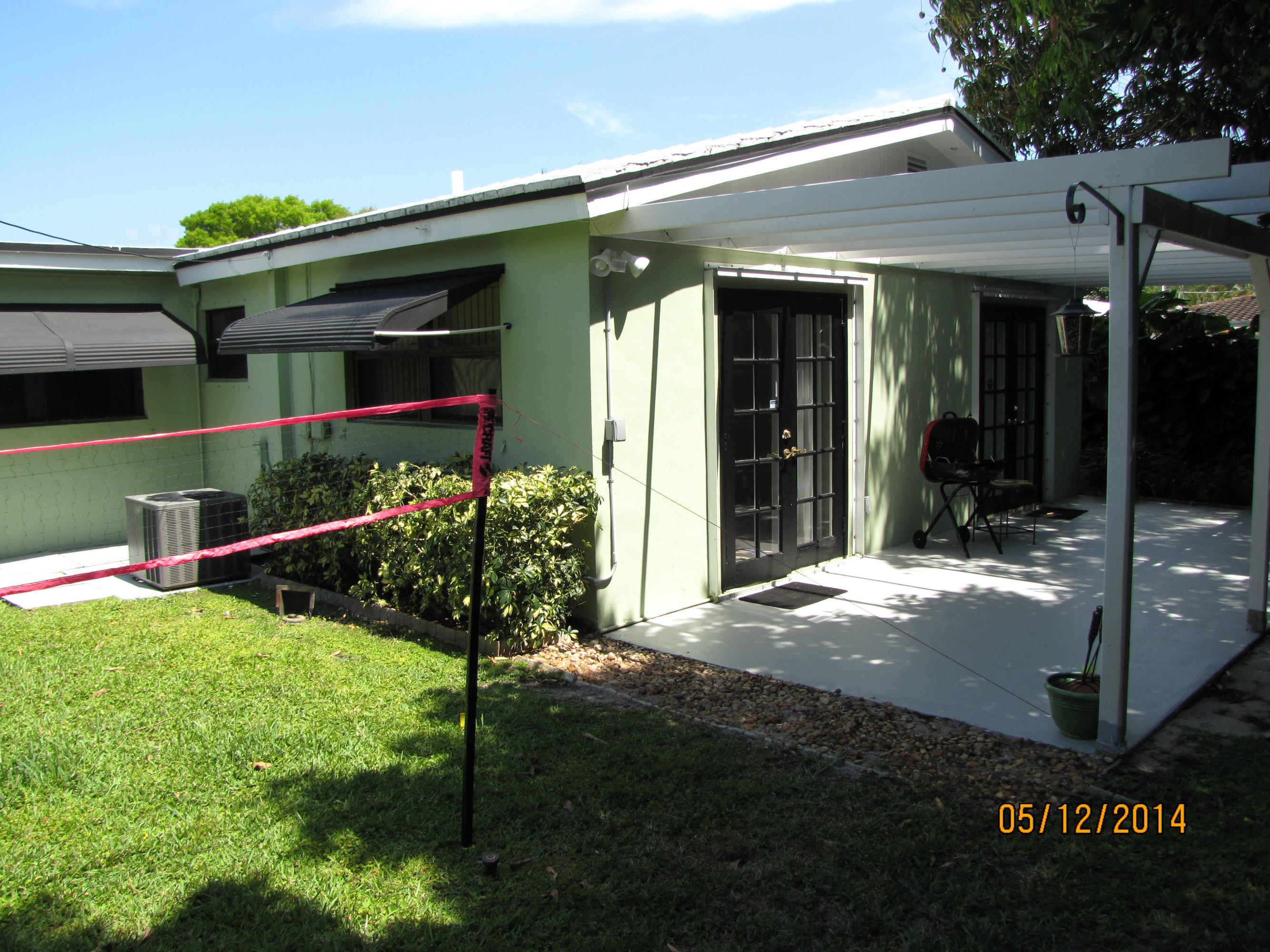 2145 Northeast 4th Way Boca Raton, FL 33431 - Photo 7 of 41 Back yard and Trellis Covered Patio