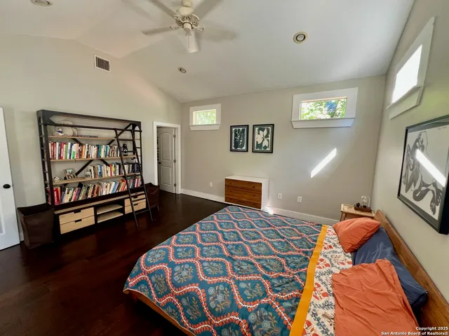 a bedroom with furniture and window