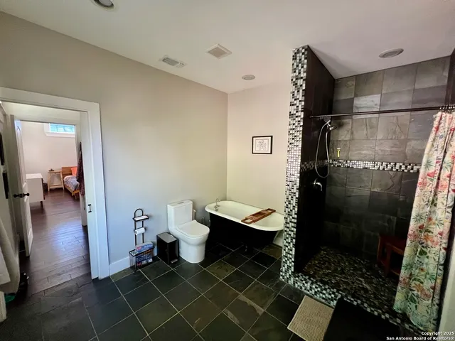 a bathroom with a sink and a shower