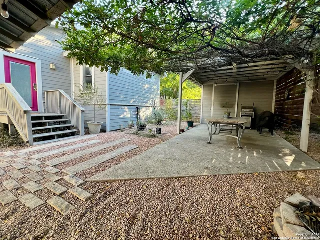 a view of a backyard with a patio
