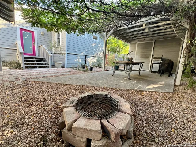 a backyard of a house with seating space