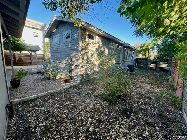 a backyard of a house with lots of green space