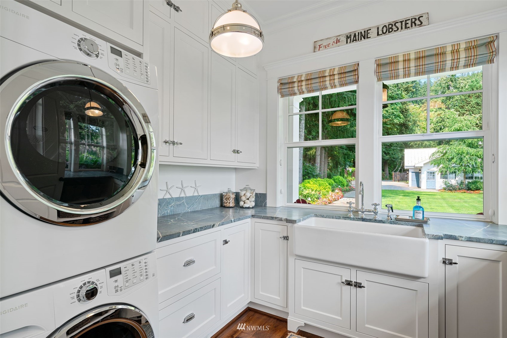 6797 Northeast North Shore Road Belfair, WA 98528 - Photo 14 of 40 a view of a kitchen with washing machine and a sink