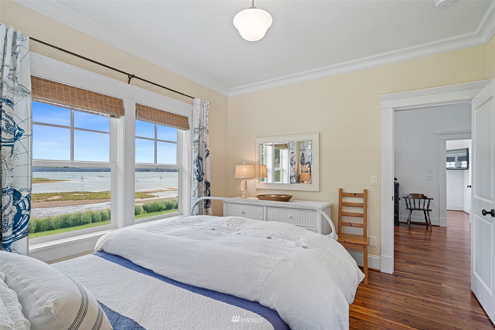6797 Northeast North Shore Road Belfair, WA 98528 - Photo 20 of 40 a bedroom with a bed and wooden floor