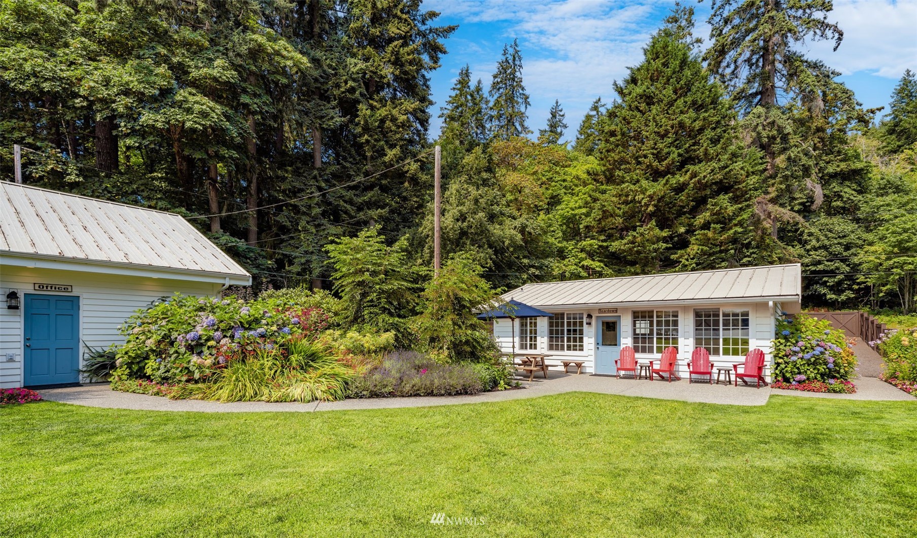 6797 Northeast North Shore Road Belfair, WA 98528 - Photo 25 of 40 a view of a house with a yard porch and sitting area
