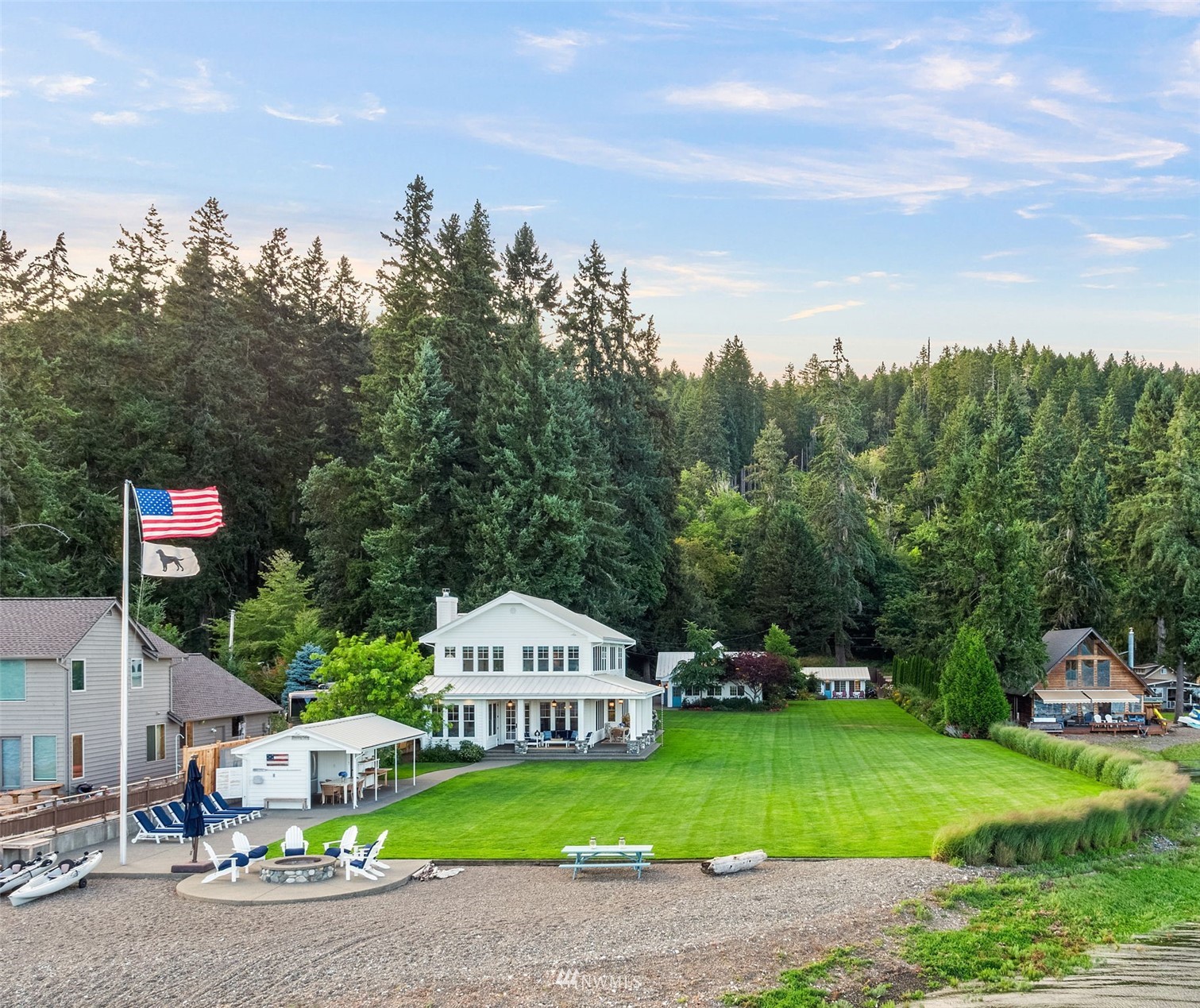 6797 Northeast North Shore Road Belfair, WA 98528 - Photo 35 of 40 a view of a house with a garden and trees