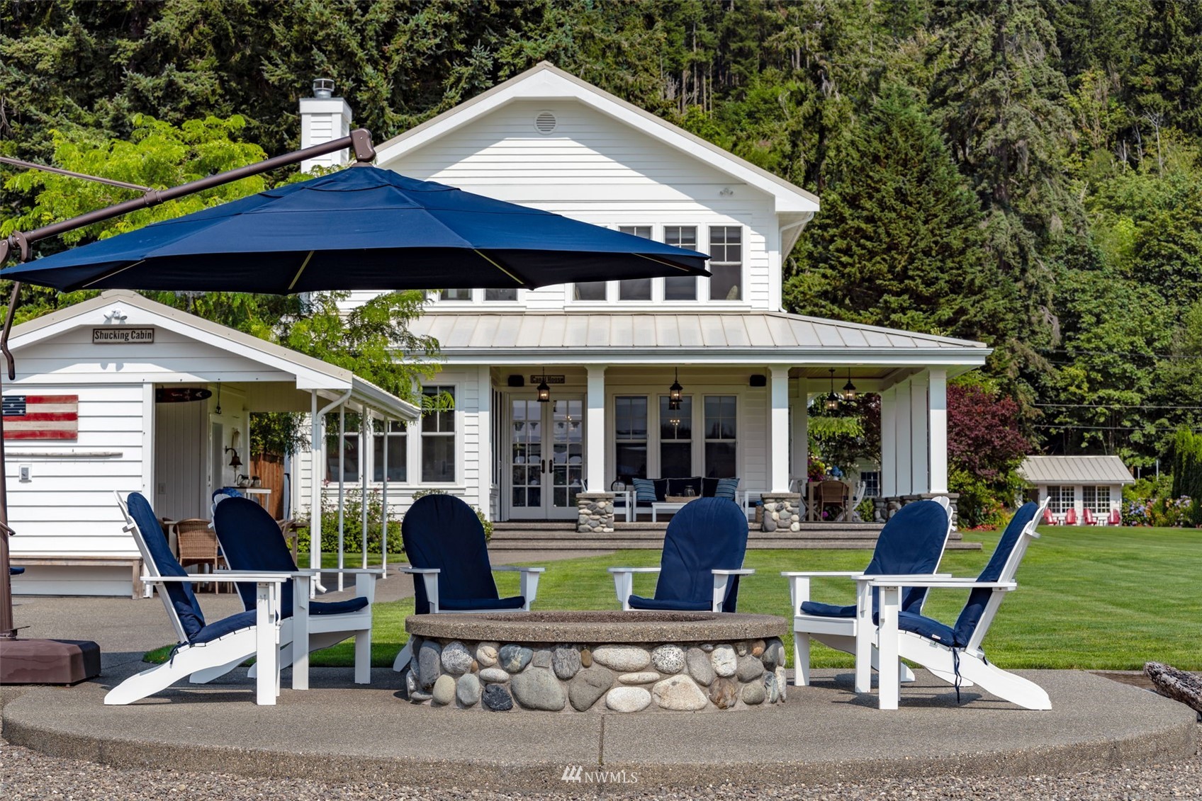 6797 Northeast North Shore Road Belfair, WA 98528 - Photo 36 of 40 a view of a chair and table in the backyard