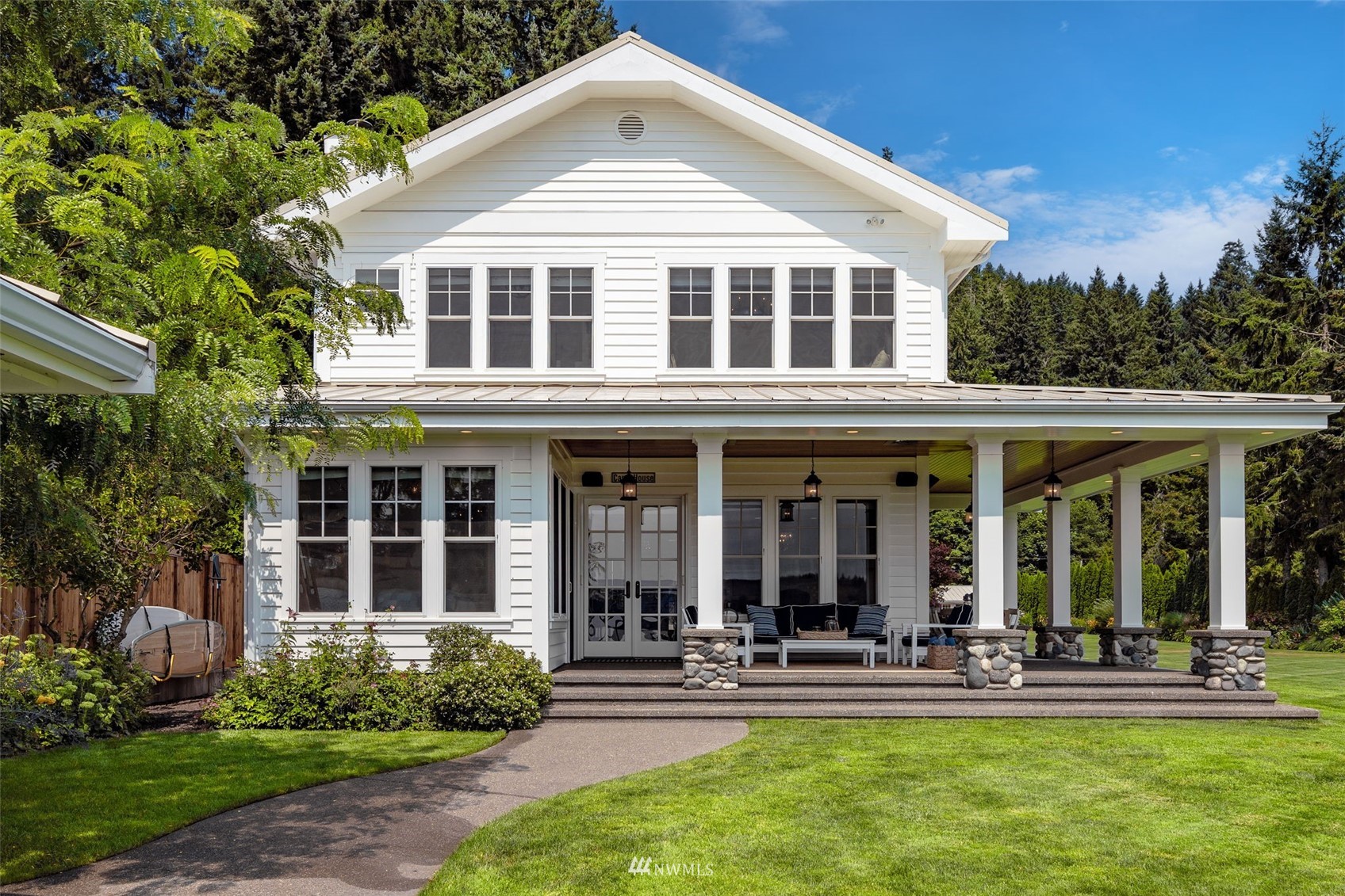 6797 Northeast North Shore Road Belfair, WA 98528 - Photo 39 of 40 a front view of a house with small yard and plants