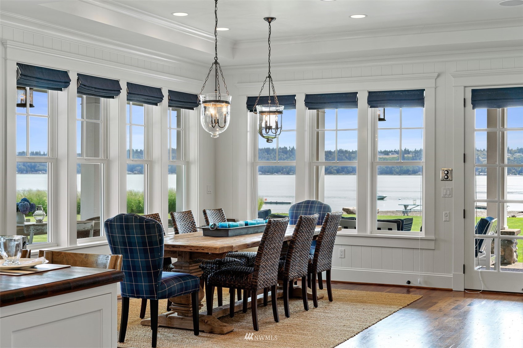 6797 Northeast North Shore Road Belfair, WA 98528 - Photo 8 of 40 a view of a dining room with furniture window and wooden floor