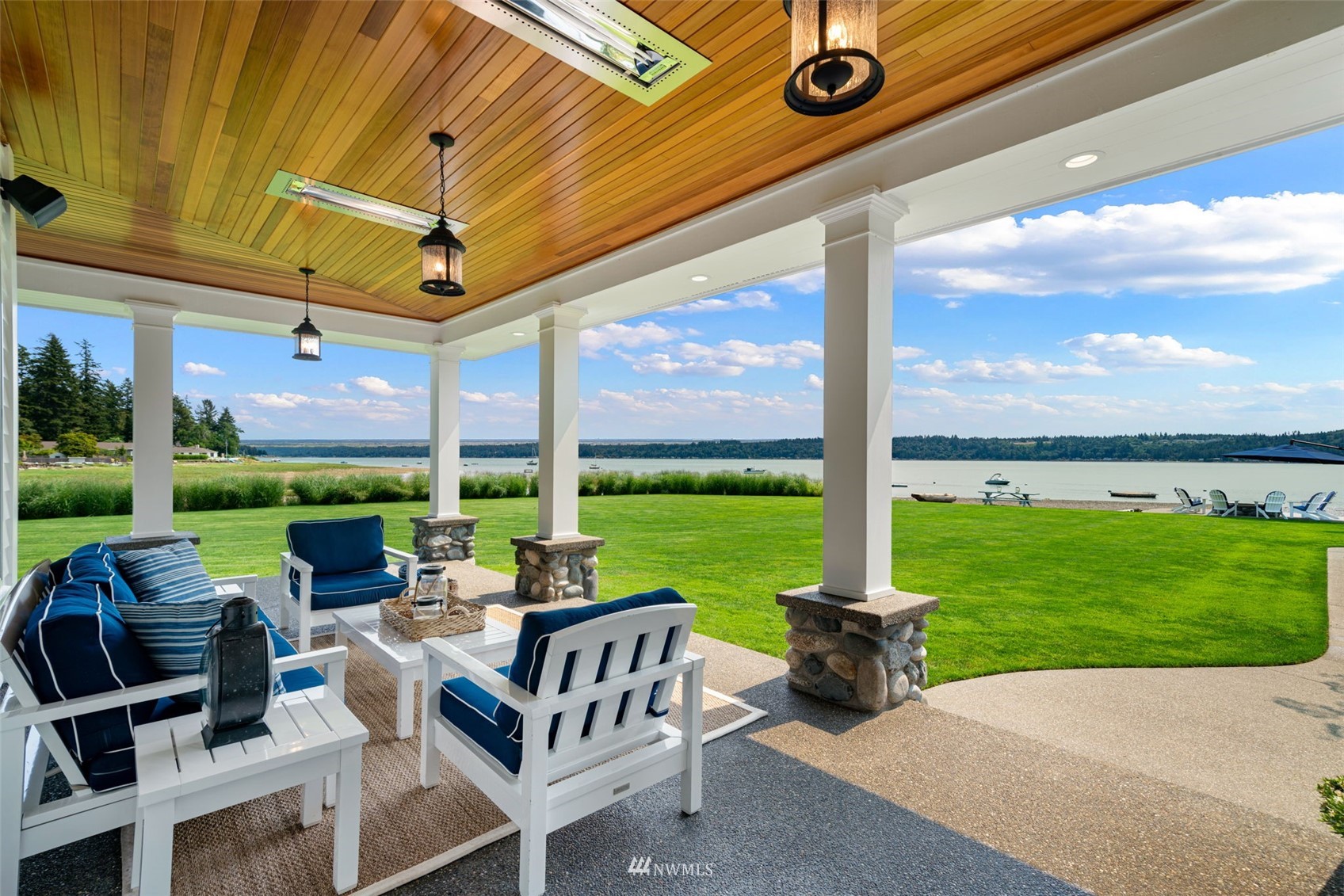 6797 Northeast North Shore Road Belfair, WA 98528 - Photo 10 of 40 a view of a patio with a dining table and chairs with garden view