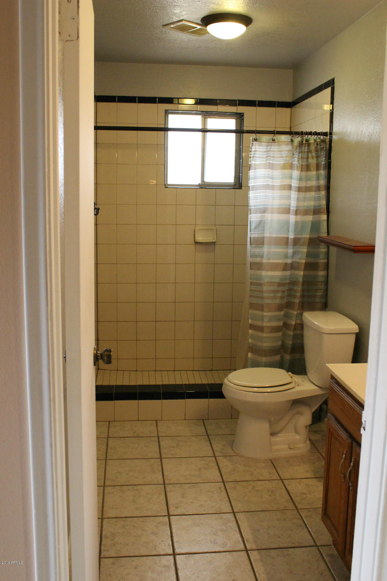 4101 West Hatcher Road Phoenix, AZ 85051 - Photo 11 of 16 4101 W Hatcher Rd Guest Bathroom