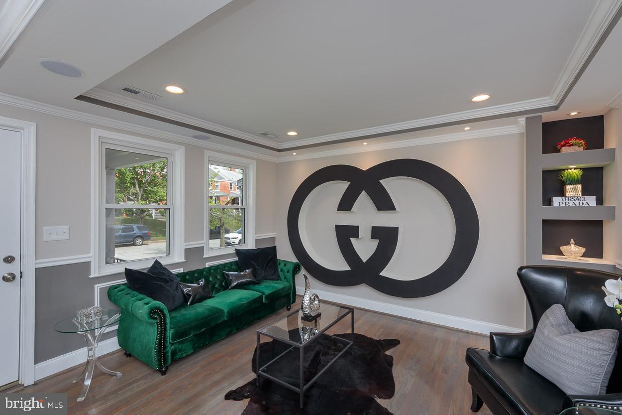5923 Falkirk Road Baltimore, MD 21239 - Photo 2 of 27 a living room with furniture and a large window