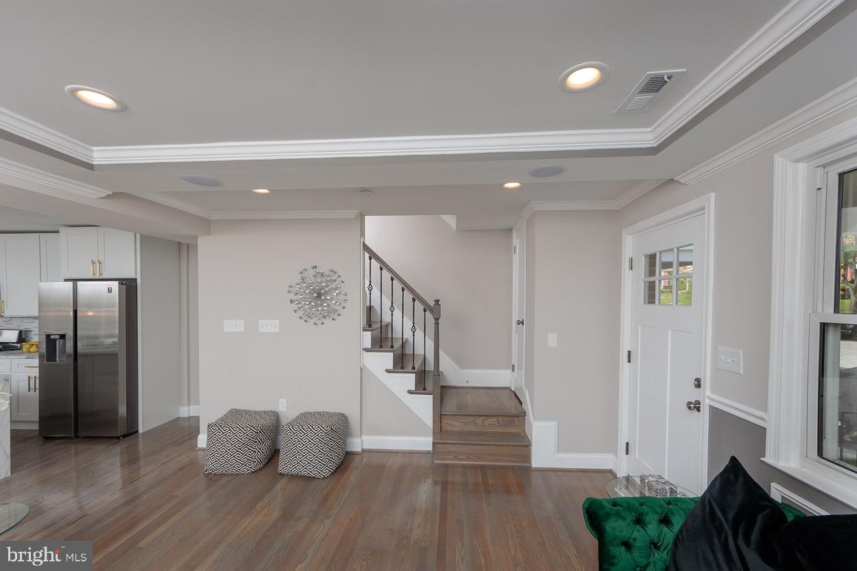 5923 Falkirk Road Baltimore, MD 21239 - Photo 16 of 27 a view of entryway and hall with wooden floor