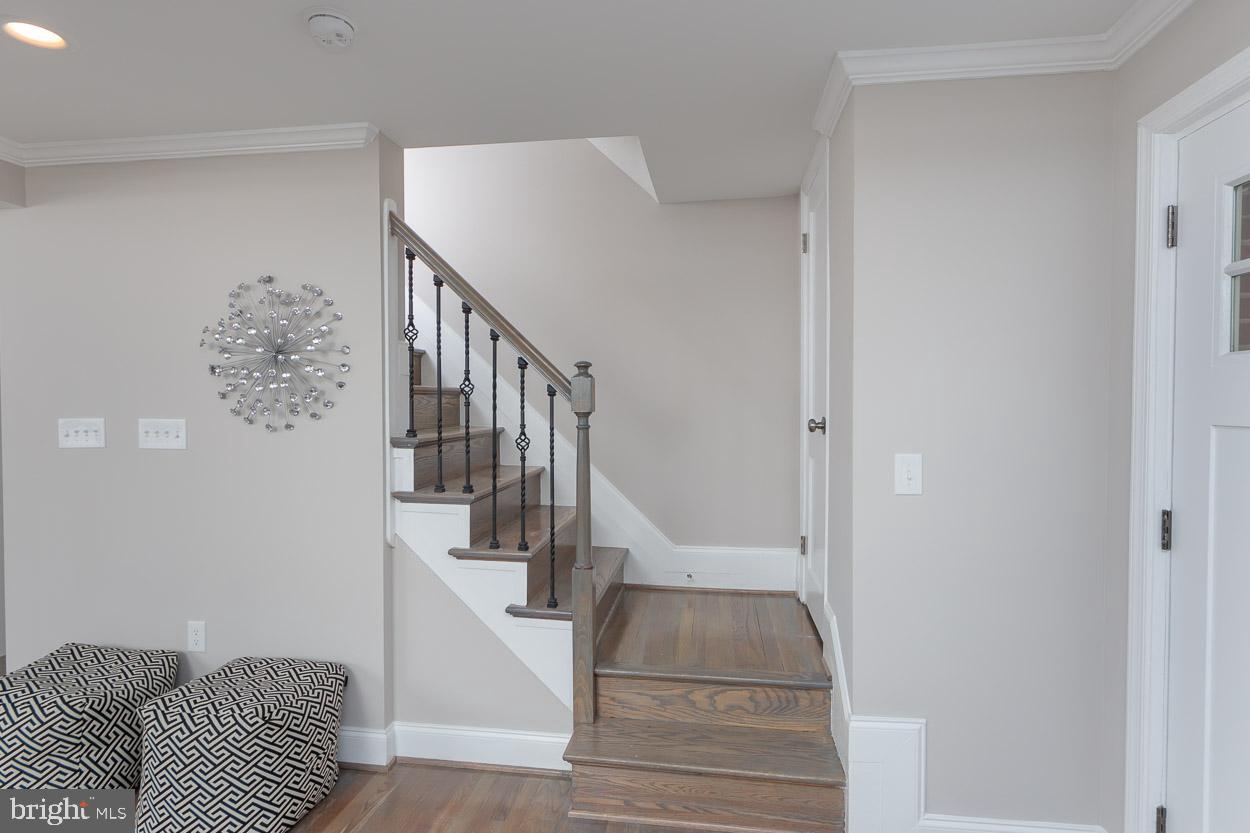 5923 Falkirk Road Baltimore, MD 21239 - Photo 17 of 27 a view of entryway and hall with wooden floor