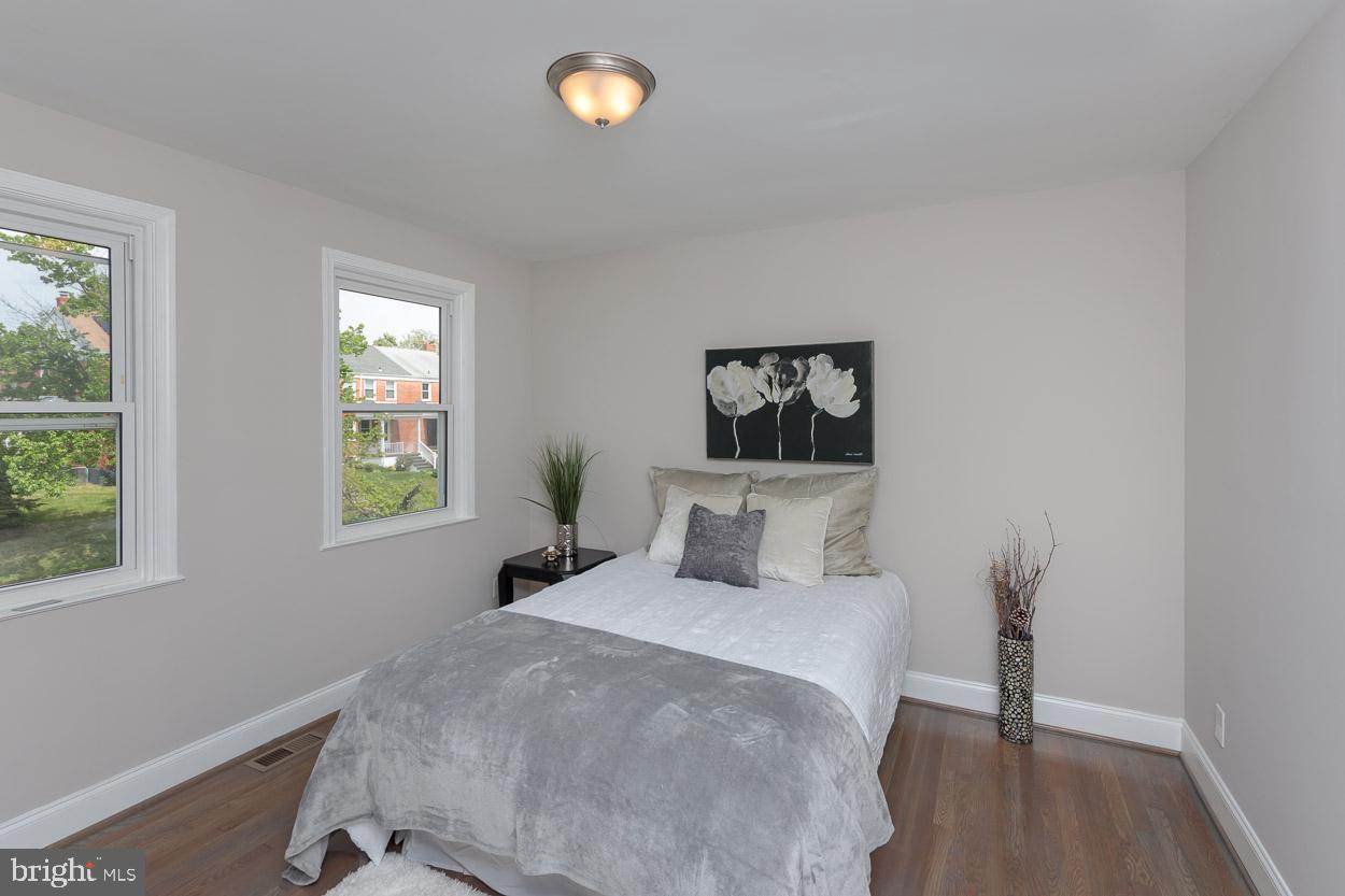 5923 Falkirk Road Baltimore, MD 21239 - Photo 18 of 27 a bedroom with a bed and a window