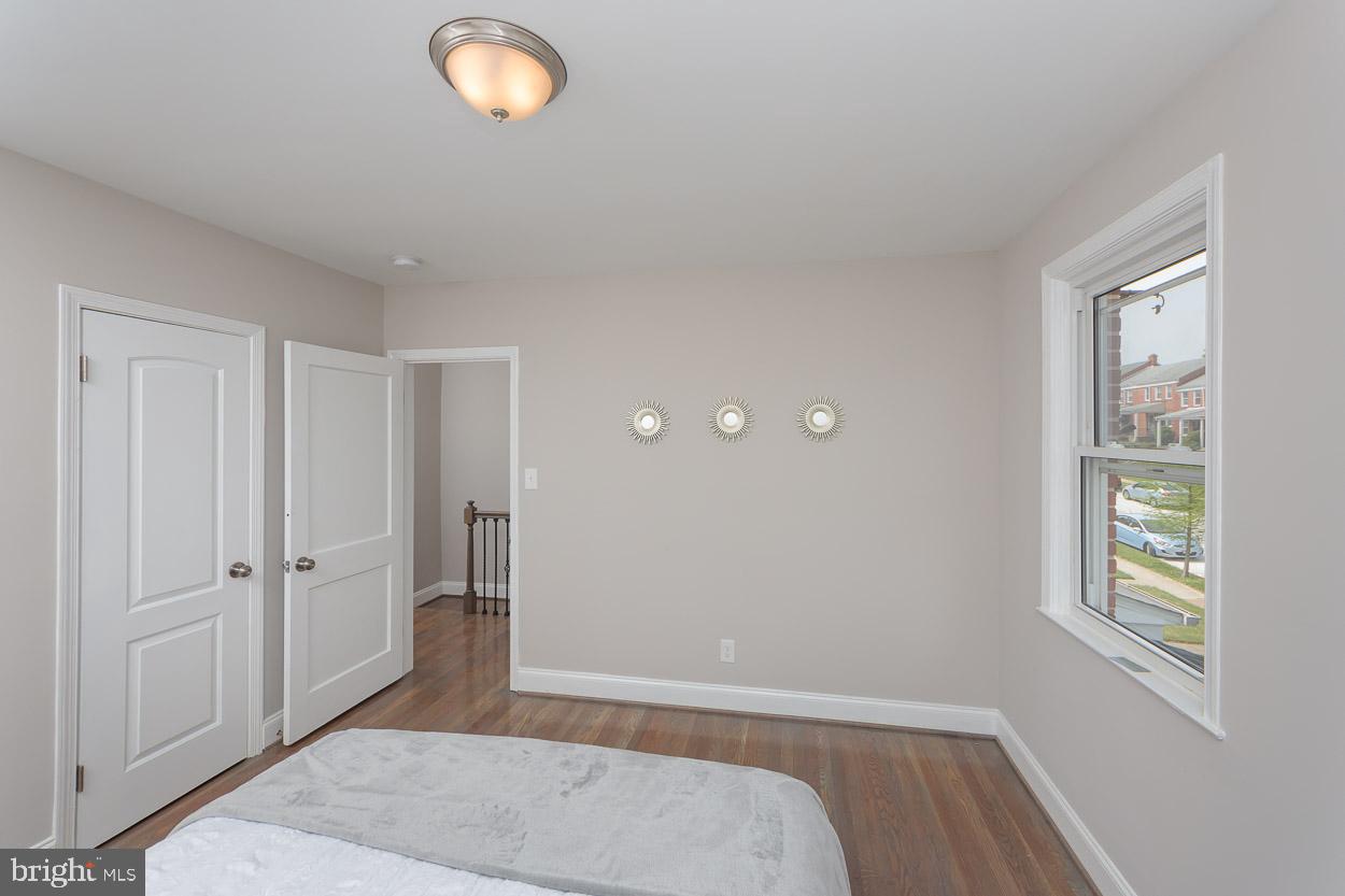 5923 Falkirk Road Baltimore, MD 21239 - Photo 19 of 27 a view of livingroom with window and hardwood floor