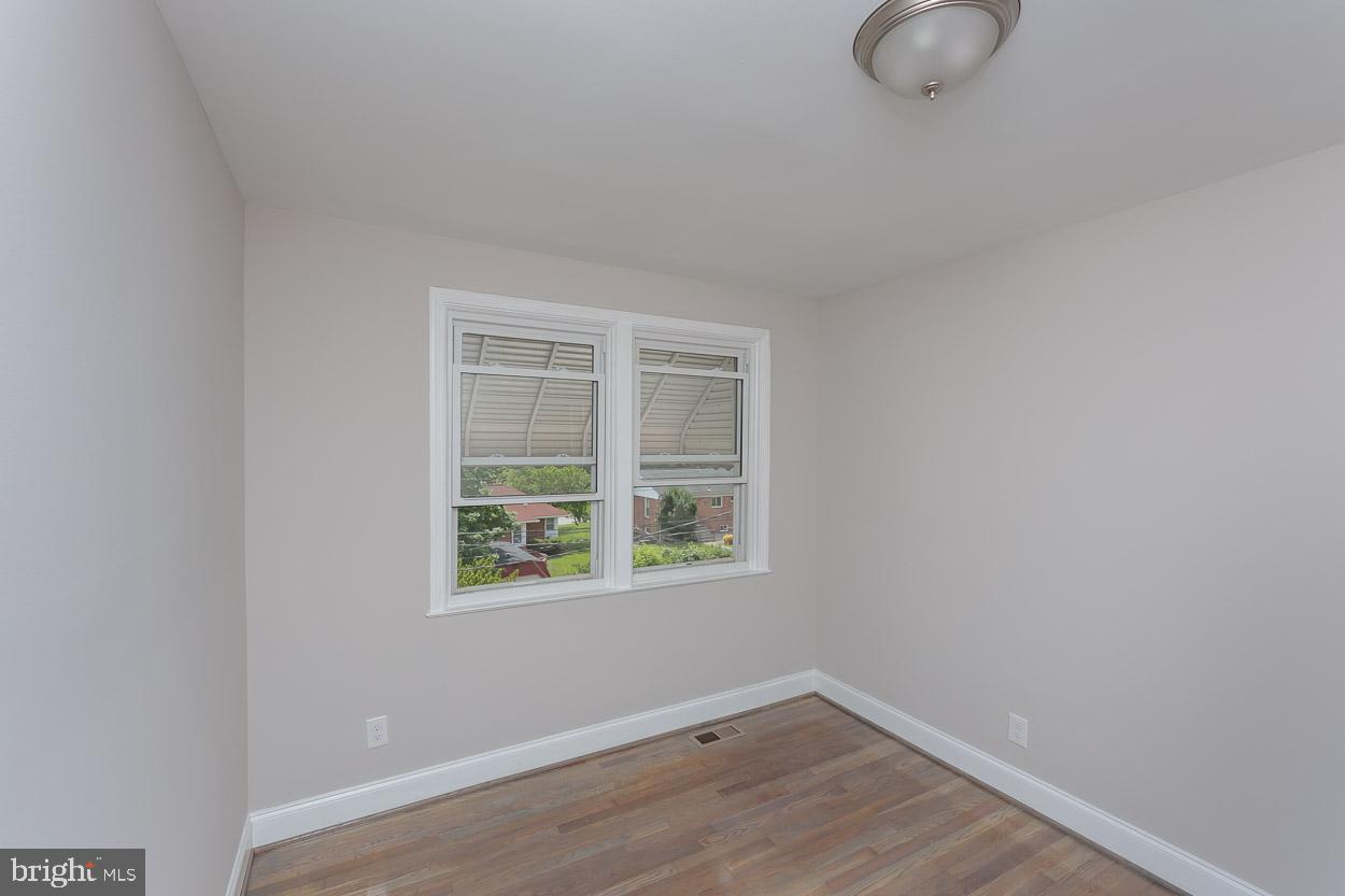 5923 Falkirk Road Baltimore, MD 21239 - Photo 20 of 27 a view of a room that has a window in it