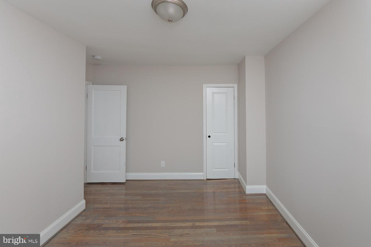5923 Falkirk Road Baltimore, MD 21239 - Photo 21 of 27 a view of room with wooden floor
