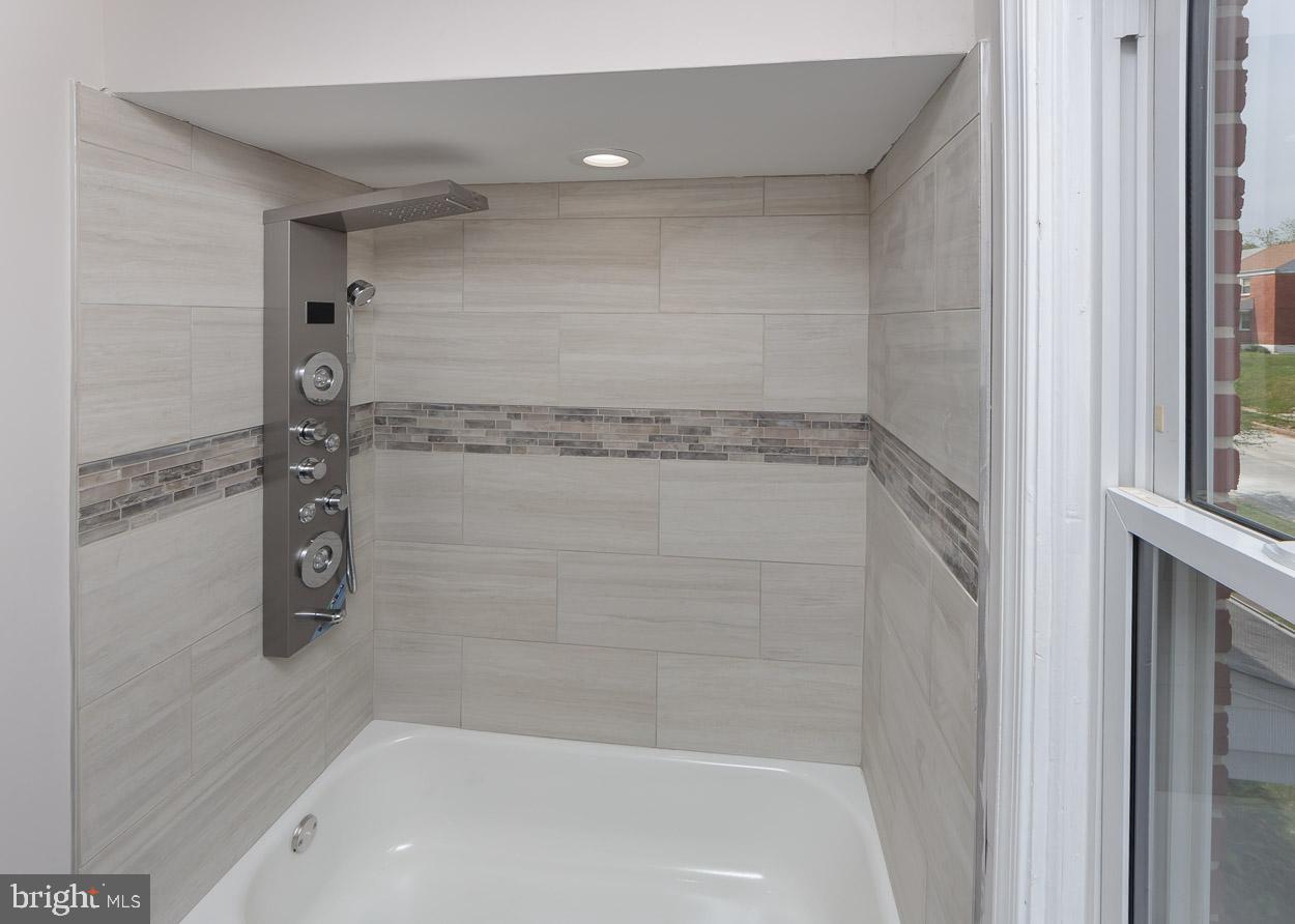 5923 Falkirk Road Baltimore, MD 21239 - Photo 23 of 27 a bathroom with a shower