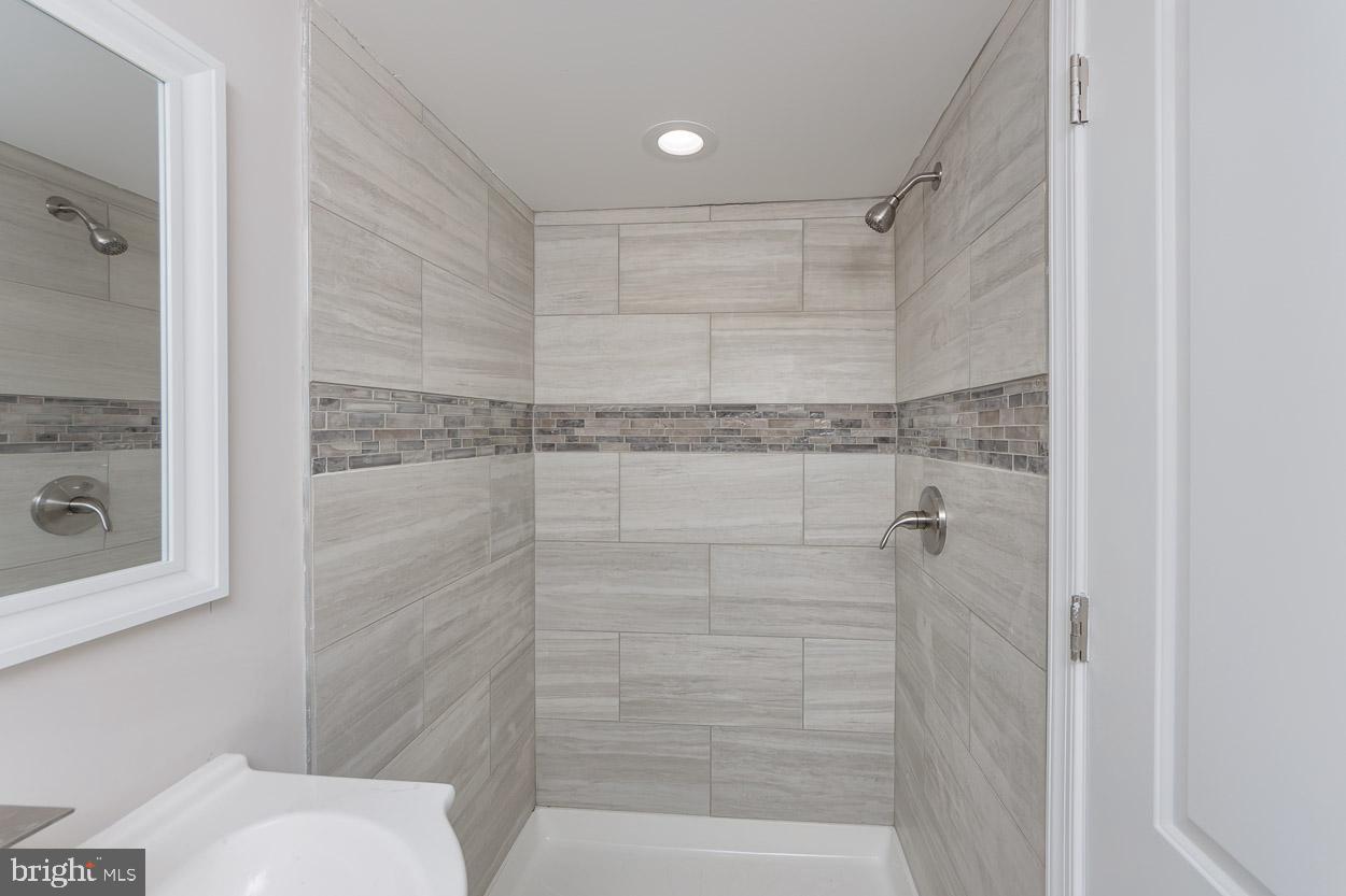 5923 Falkirk Road Baltimore, MD 21239 - Photo 27 of 27 a bathroom with a shower and toilet
