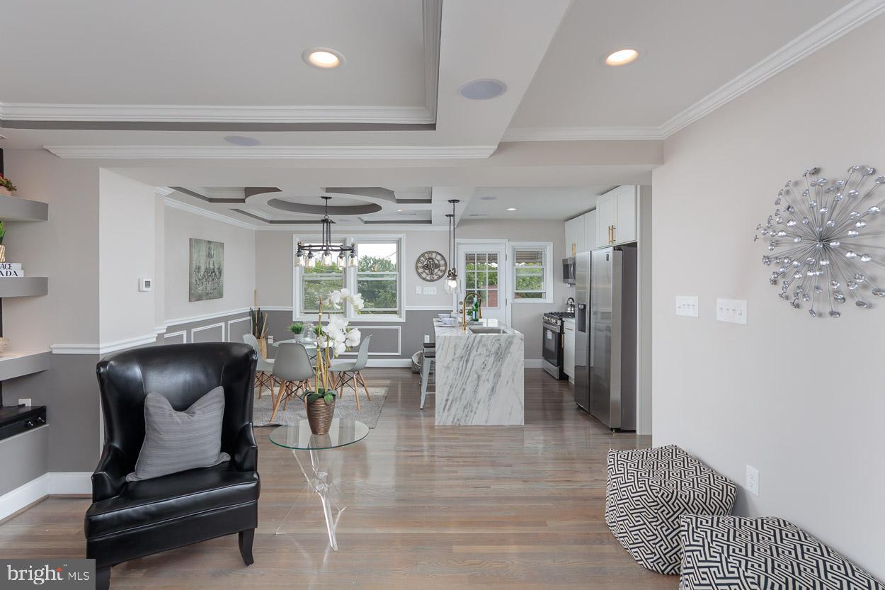 5923 Falkirk Road Baltimore, MD 21239 - Photo 7 of 27 a dining room with furniture and a large window