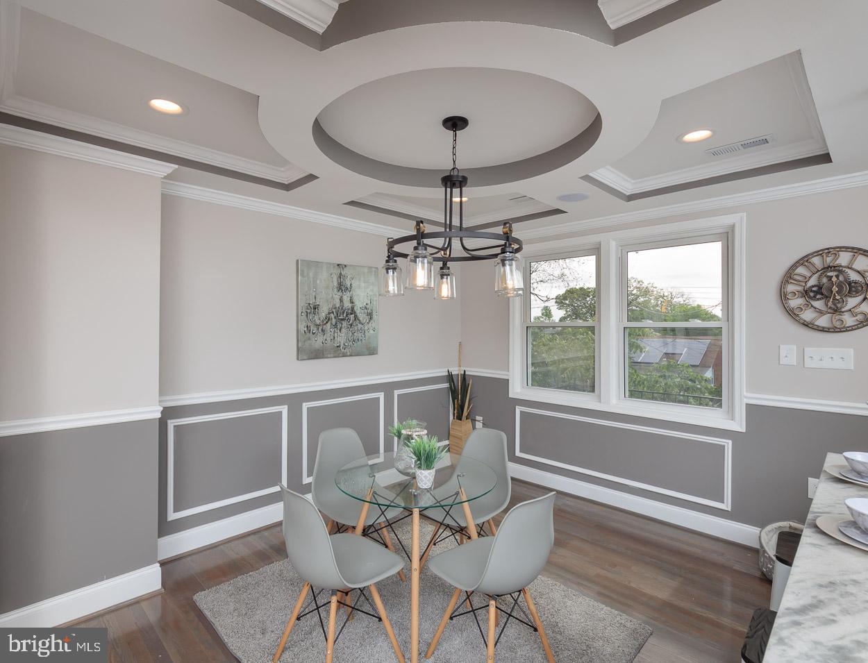 5923 Falkirk Road Baltimore, MD 21239 - Photo 9 of 27 a dining room with furniture a chandelier and window