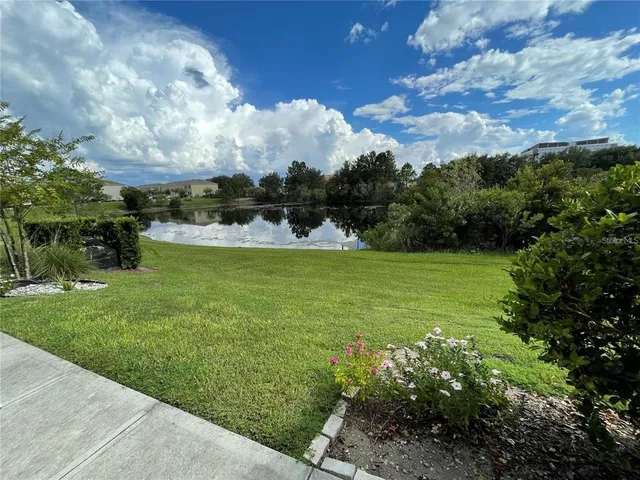 a view of a fountain in front of a house