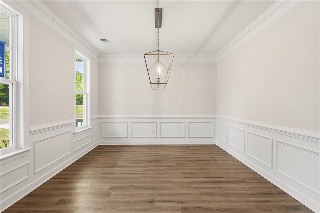 1108 Manse Jolly Road Anderson, SC 29621 - Photo 5 of 45 This spacious dining area features elegant wainscoting and abundant natural light, perfect for gatherings.