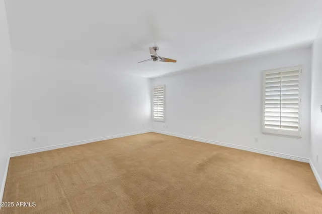 a spacious bathroom with a granite countertop sink and a mirror