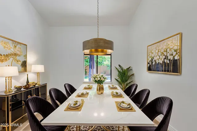 a room with a window and a ceiling fan