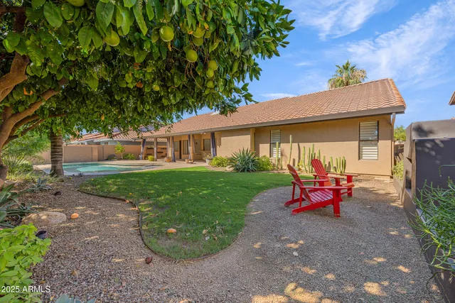 a view of a patio with furniture and a yard