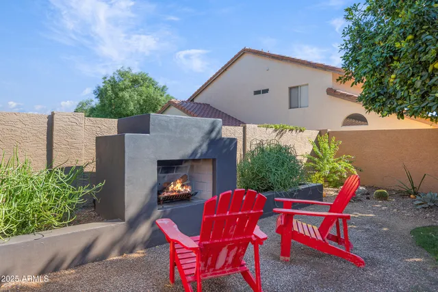a view of a house with backyard sitting area and porch