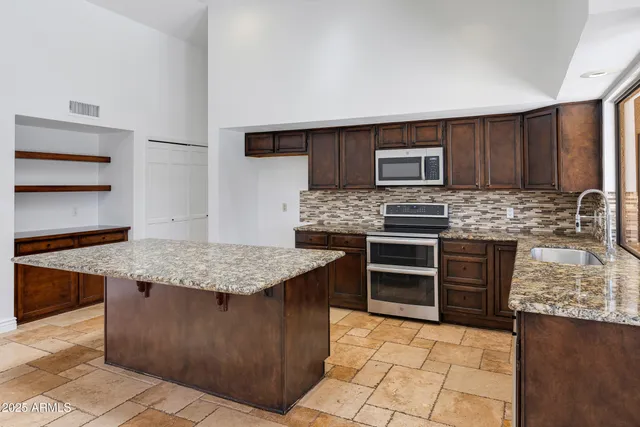 a kitchen with granite countertop lots of counter top space