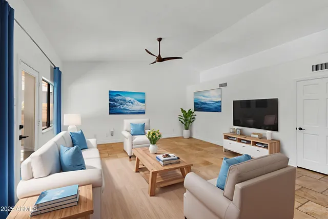 a living room with furniture and a window