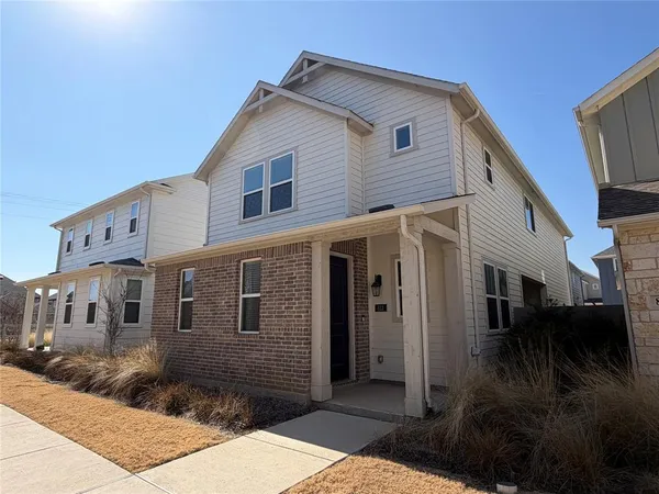 a front view of a house with yard