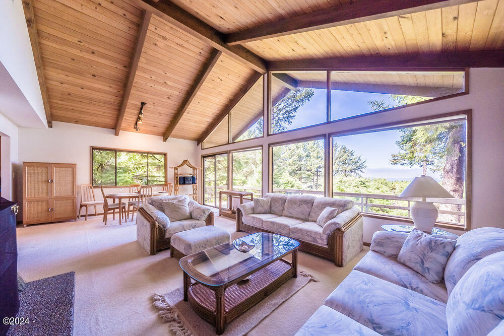 114 Ridge Crest Road Gleneden Beach, OR 97388 - Photo 19 of 40 a living room with furniture and a large window