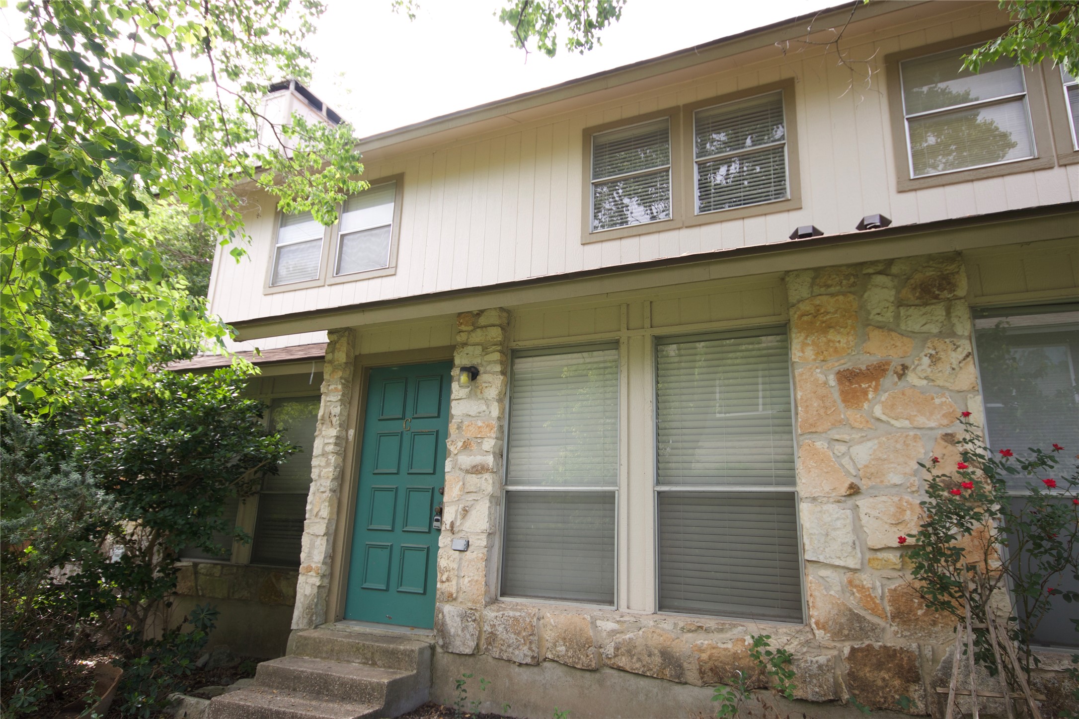 1405 D Camp Craft Road, Unit D West Lake Hills, TX 78746 - Photo 1 of 9 Doorway to property featuring stone siding