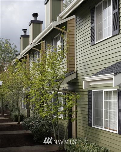 412 Center Road, Unit C3 Everett, WA 98204 - Photo 1 of 1 a large white building with trees in front of it