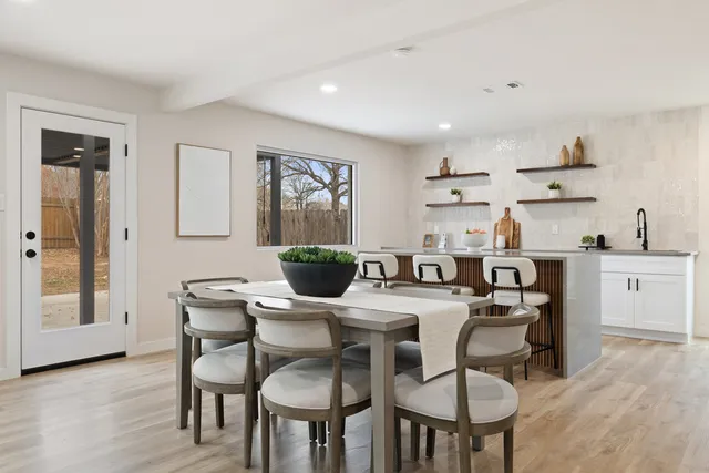 a dining room with furniture and window