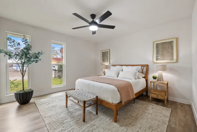 a bed room with a bed and a window