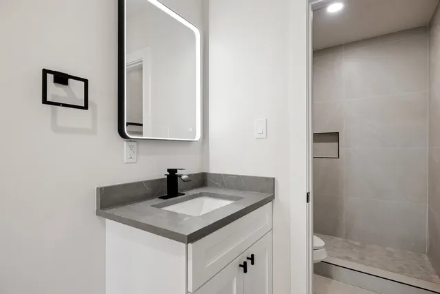 a bathroom with a sink and a mirror
