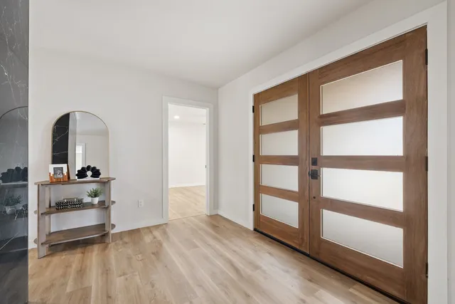 a view of living room with furniture and wooden floor