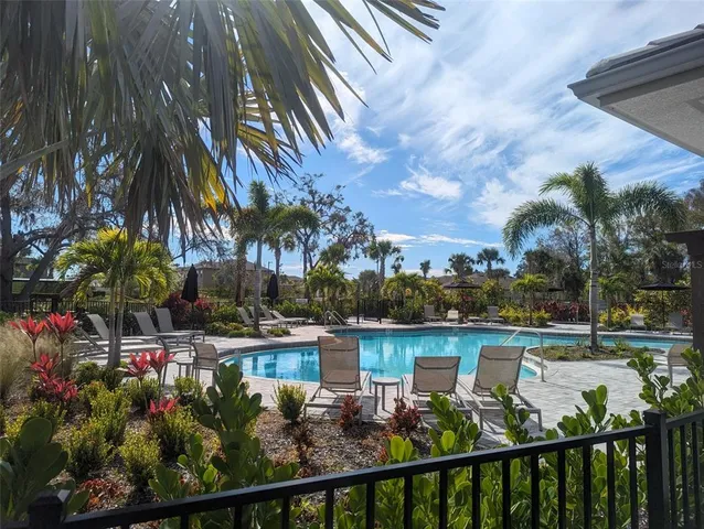 a kitchen with a table chairs and a window